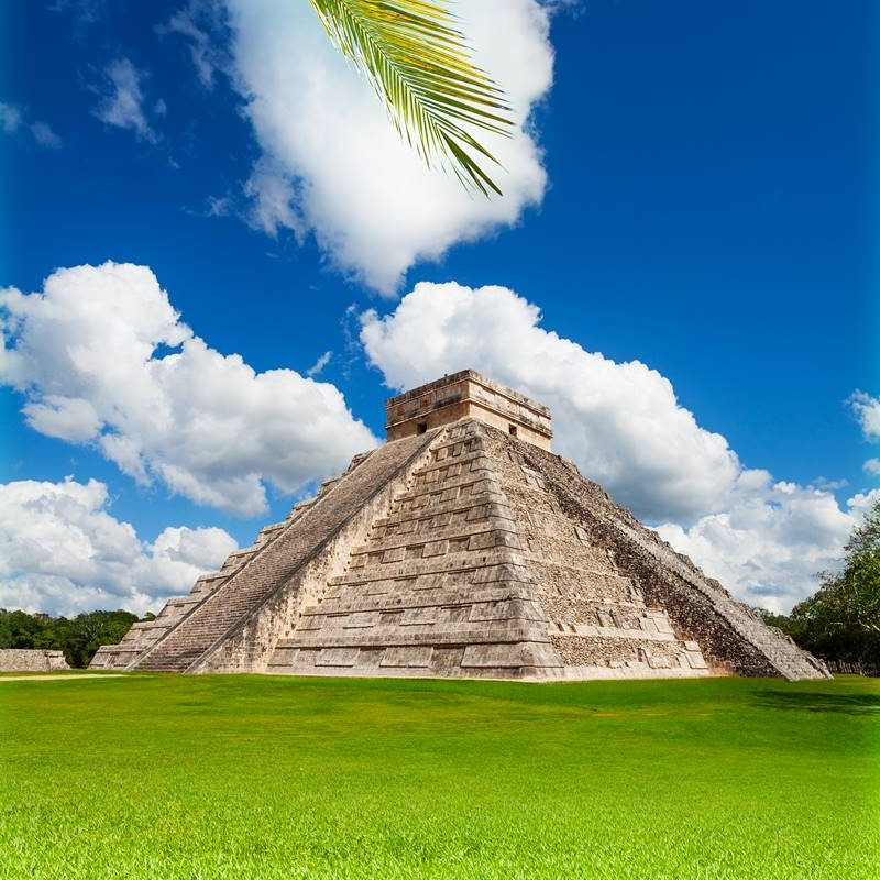 Nice view of Chichen, Itza monument, Mexico on green grass